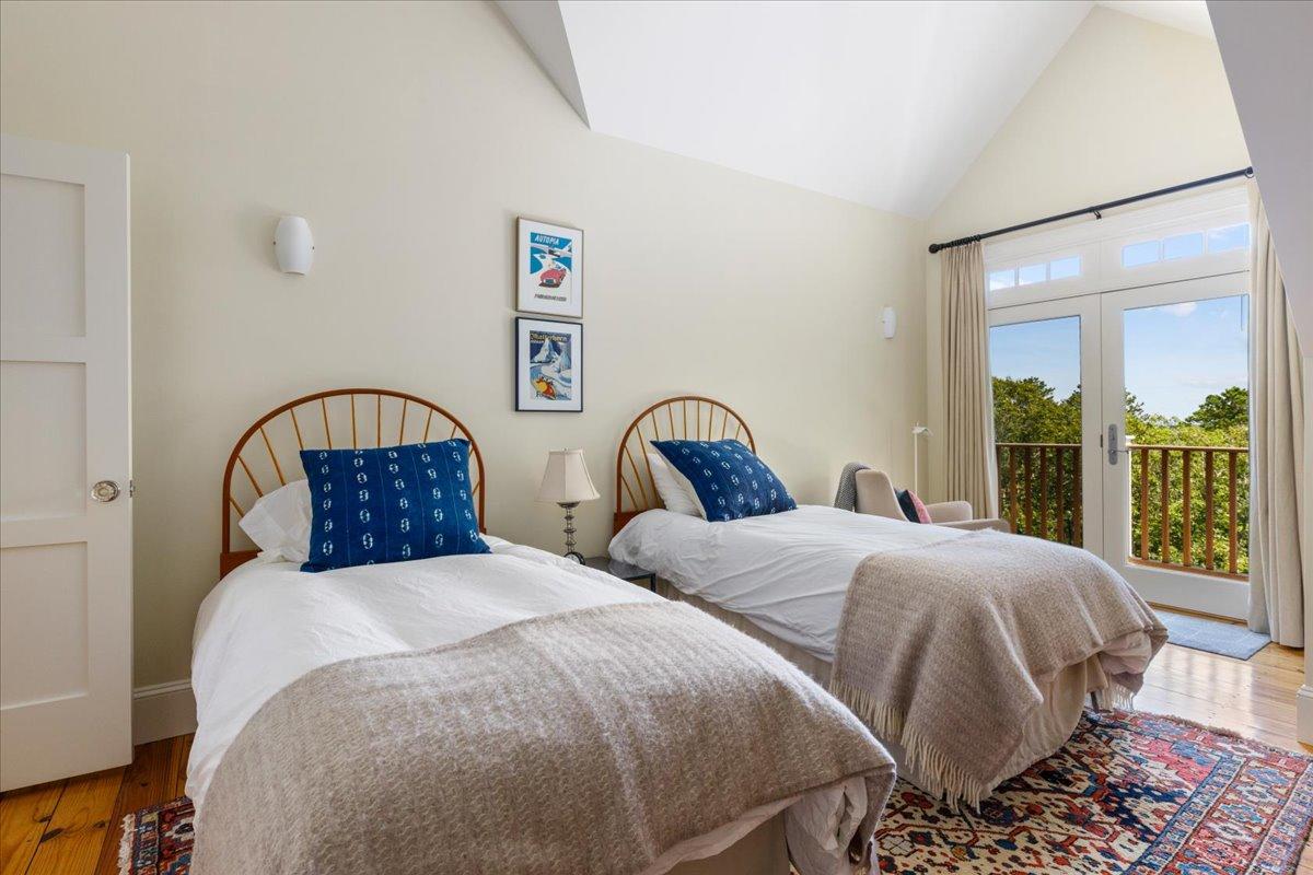 58 Slough Pond Road Truro, MA 02666 - Photo 45 of 82 a bedroom with two beds and large window