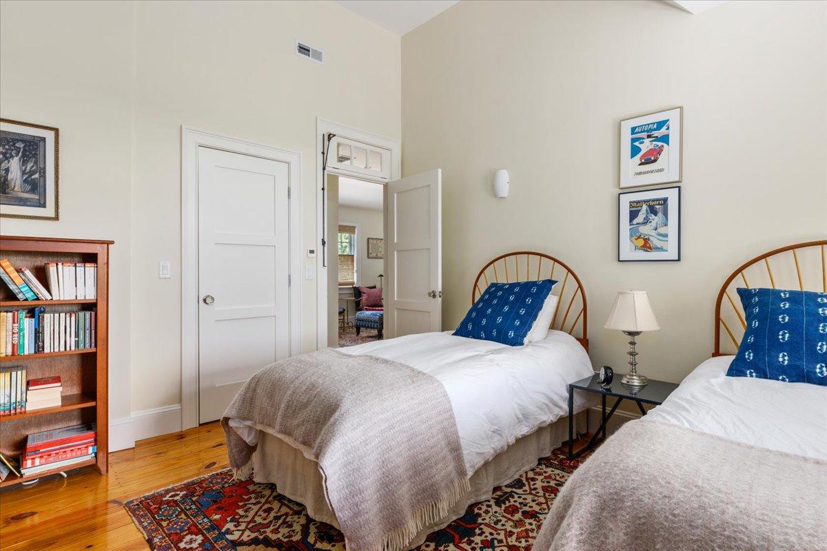 58 Slough Pond Road Truro, MA 02666 - Photo 46 of 82 a bedroom with two beds and a book shelf