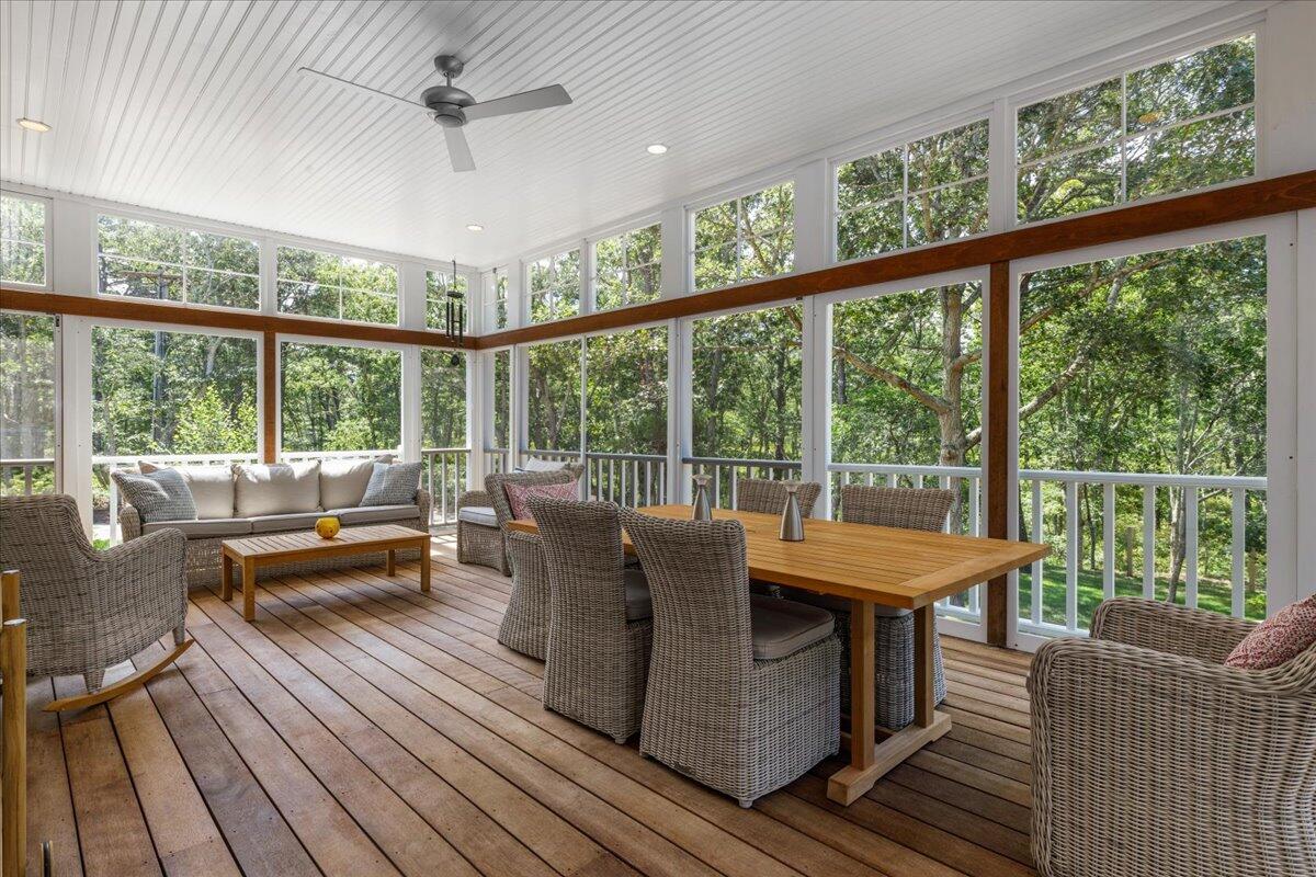58 Slough Pond Road Truro, MA 02666 - Photo 50 of 82 a living room with furniture and a floor to ceiling window