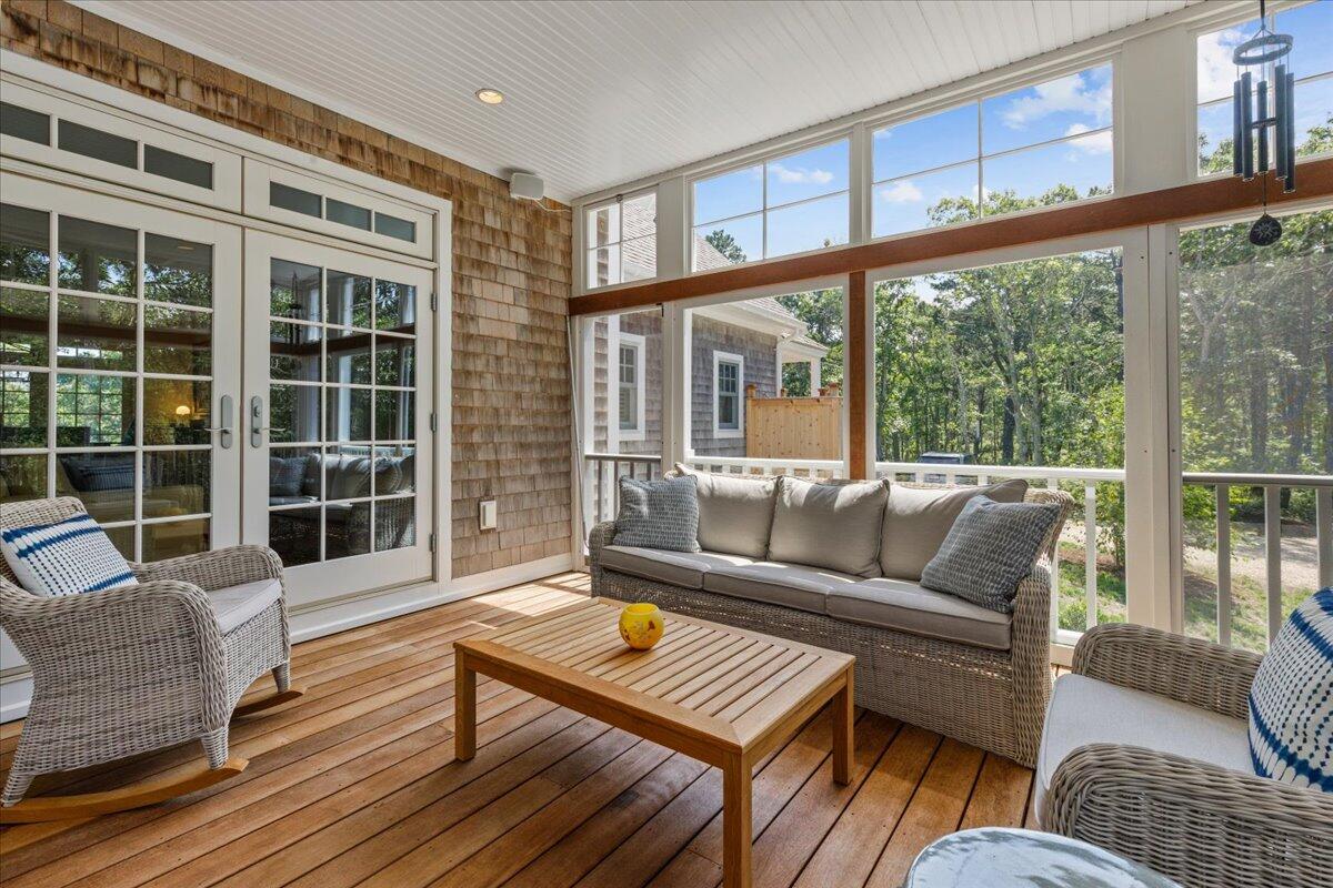 58 Slough Pond Road Truro, MA 02666 - Photo 51 of 82 a living room with furniture and a large window