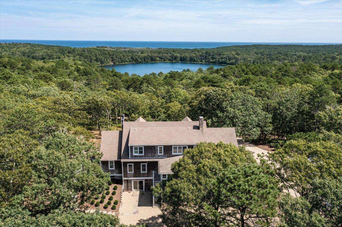 58 Slough Pond Road Truro, MA 02666 - Photo 74 of 82 an aerial view of a house with a yard and lake view