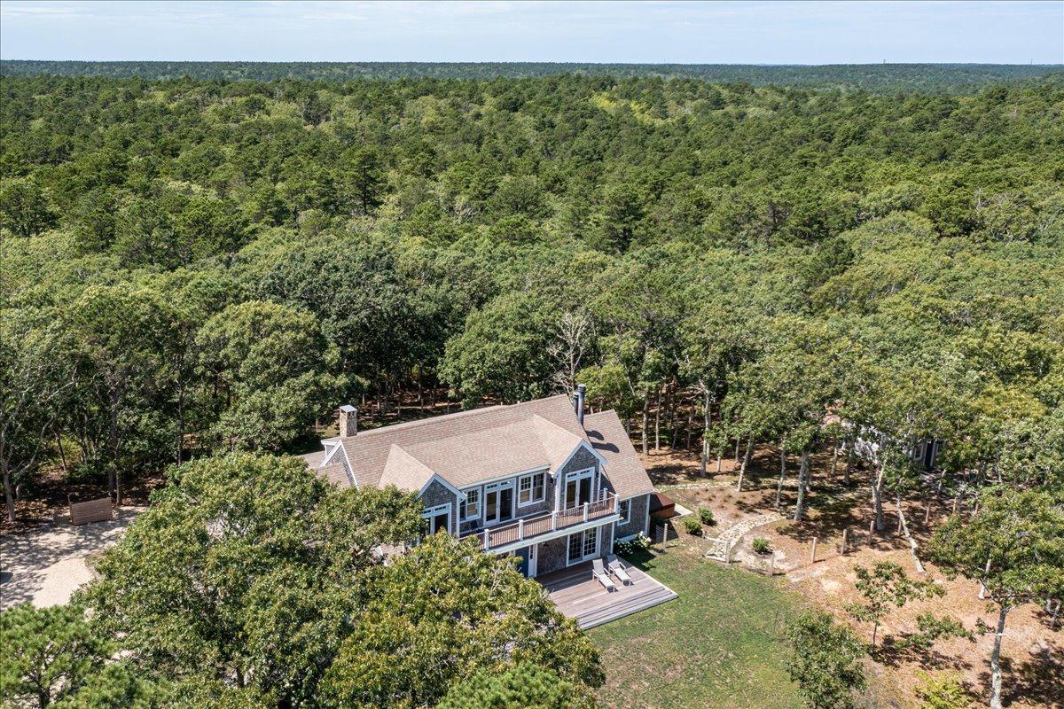 58 Slough Pond Road Truro, MA 02666 - Photo 76 of 82 an aerial view of a house with yard and outdoor seating