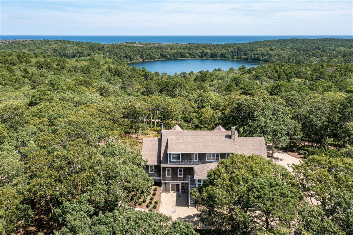 58 Slough Pond Road Truro, MA 02666 - Photo 79 of 82 an aerial view of a house with a garden and lake view