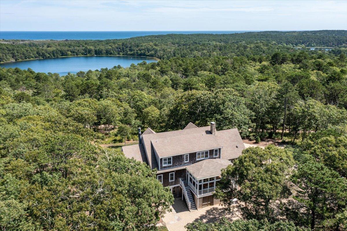 58 Slough Pond Road Truro, MA 02666 - Photo 80 of 82 an aerial view of a house with lake view and a city view