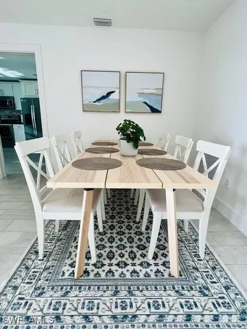 a view of a dining room with furniture