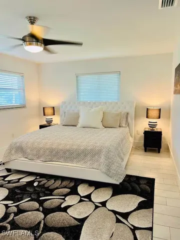 a bedroom with a bed and a couch