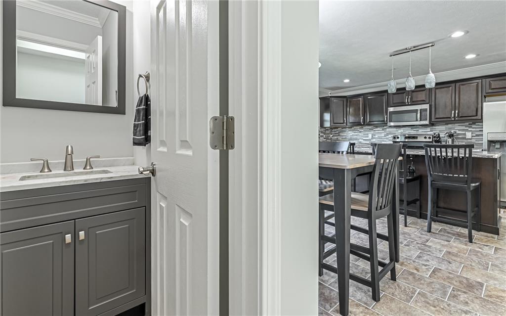 138 Rylie Drive Harmony, PA 16037 - Photo 13 of 23 a kitchen with stainless steel appliances a sink and cabinets