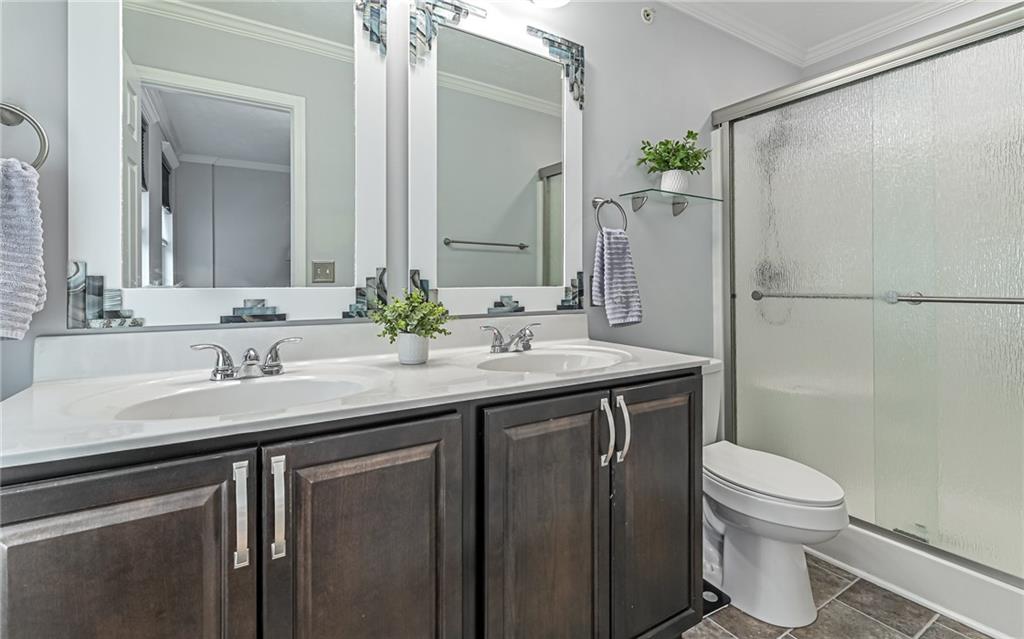 138 Rylie Drive Harmony, PA 16037 - Photo 17 of 23 a bathroom with a granite countertop sink a toilet and a mirror