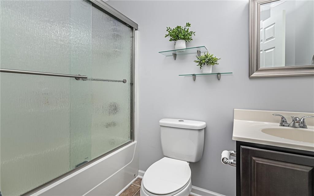 138 Rylie Drive Harmony, PA 16037 - Photo 20 of 23 a white toilet sitting next to a bathroom sink