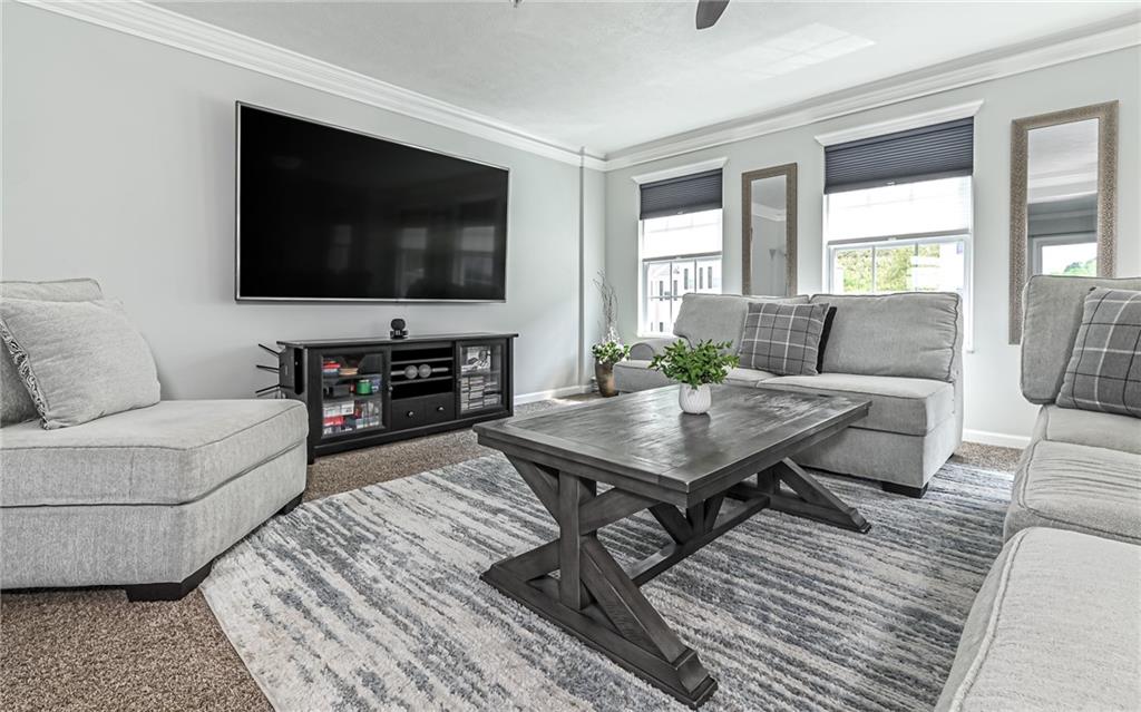 138 Rylie Drive Harmony, PA 16037 - Photo 3 of 23 a living room with furniture and a flat screen tv