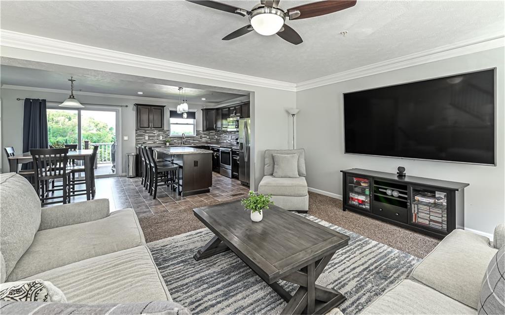 138 Rylie Drive Harmony, PA 16037 - Photo 6 of 23 a living room with furniture and a flat screen tv
