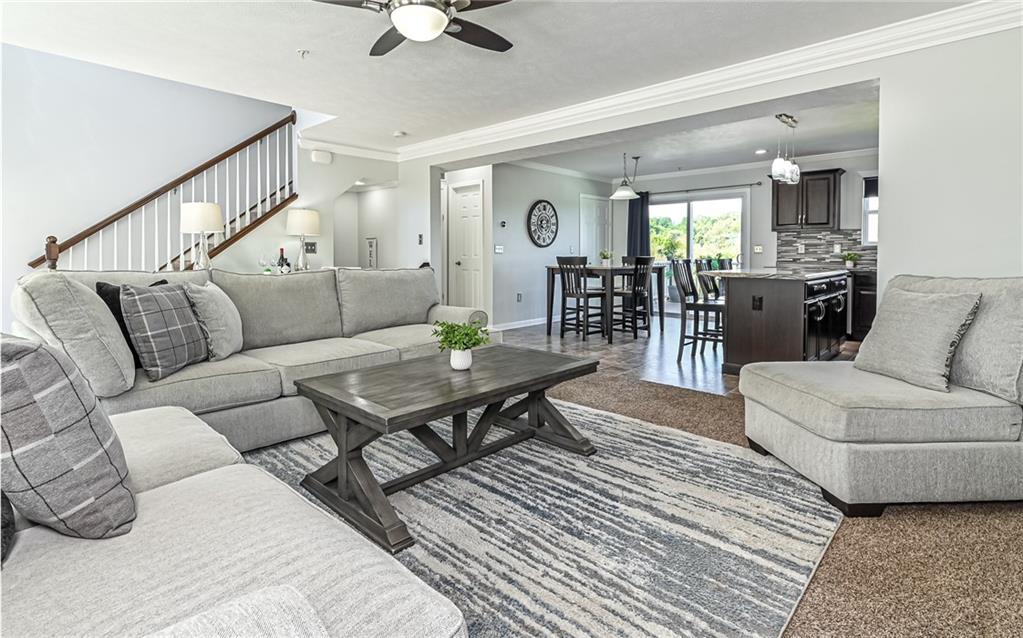 138 Rylie Drive Harmony, PA 16037 - Photo 7 of 23 a living room with furniture a rug and a chandelier