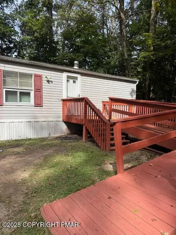 a view of a deck with a yard