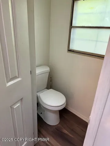 a bedroom with a bed and lamp on table