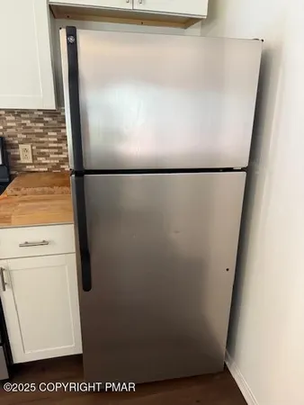 a kitchen with sink and cabinets