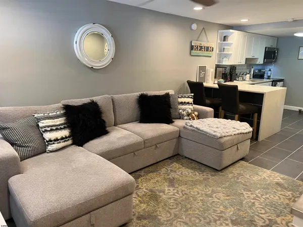 a view of kitchen with furniture and wooden floor
