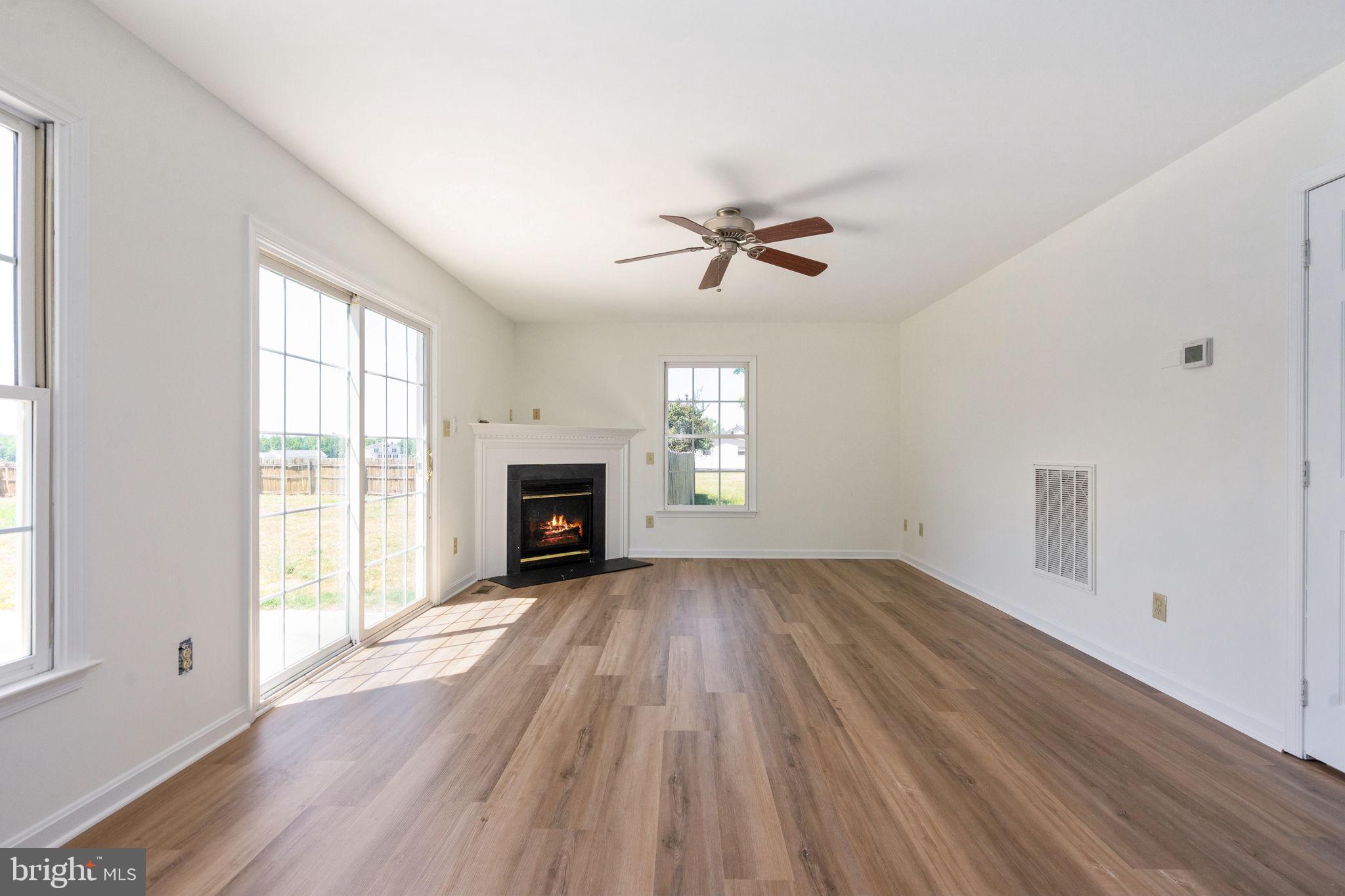 16456 Antioch Road Milford, VA 22514 - Photo 11 of 27 wooden floor in an empty room with a window