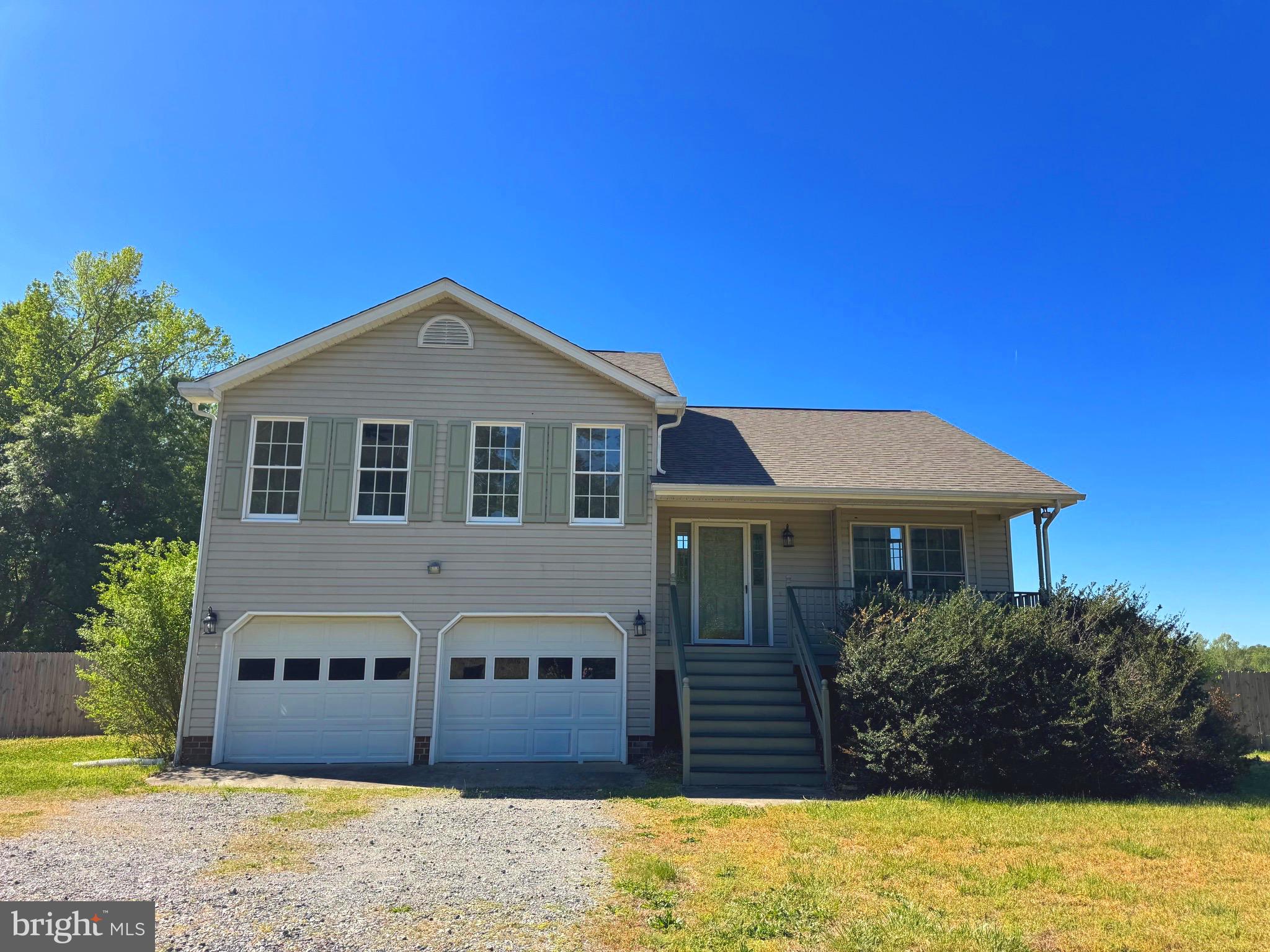 16456 Antioch Road Milford, VA 22514 - Photo 2 of 27 a front view of a house with a yard