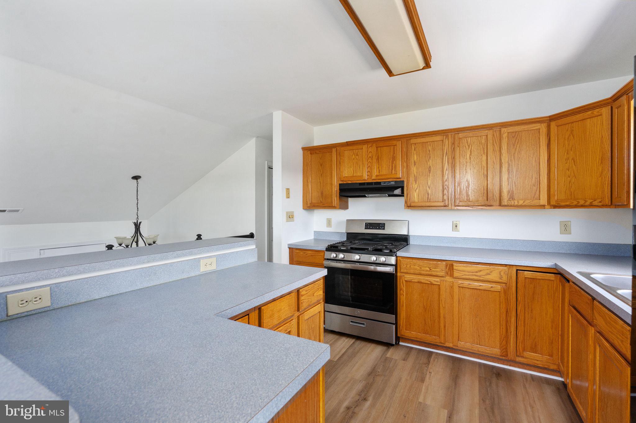 16456 Antioch Road Milford, VA 22514 - Photo 23 of 27 a kitchen with stainless steel appliances a stove a sink and a refrigerator