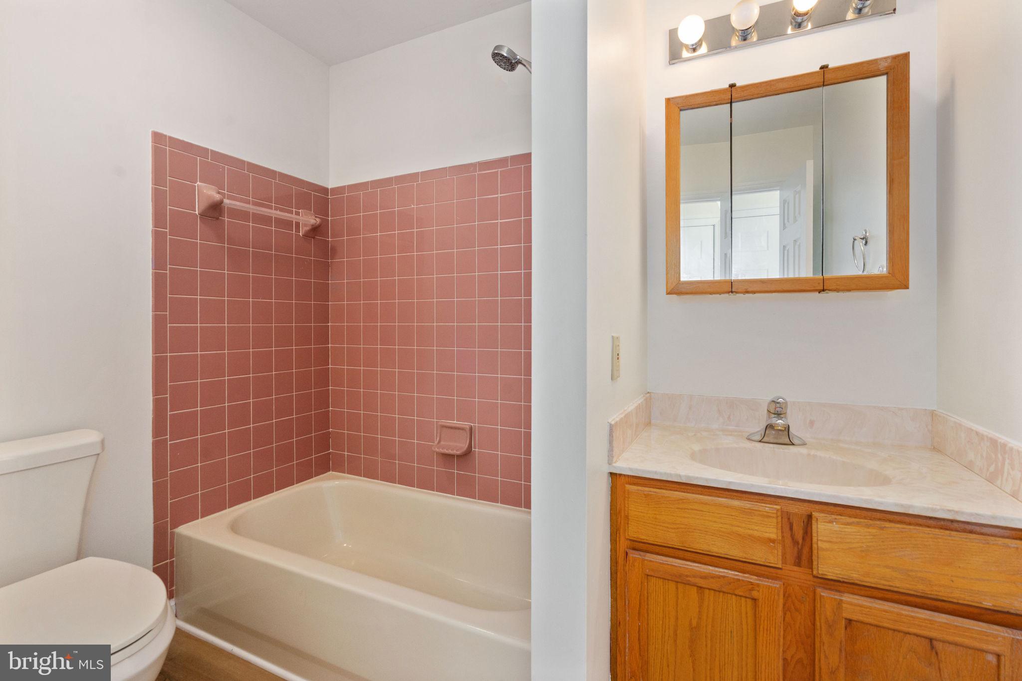 16456 Antioch Road Milford, VA 22514 - Photo 24 of 27 a bathroom with a sink a toilet and bathtub