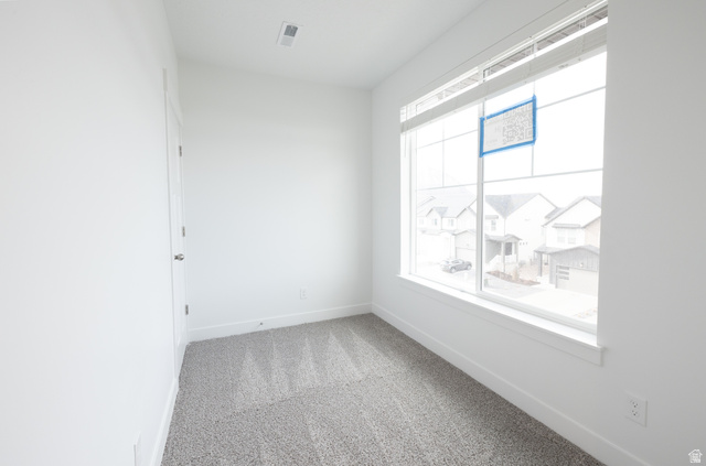 4653 South Alder Drive, Unit H302 Mapleton, UT 84664 - Photo 3 of 15 Spare room with baseboards and light carpet