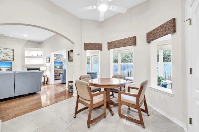 a view of a livingroom with workspace and a window