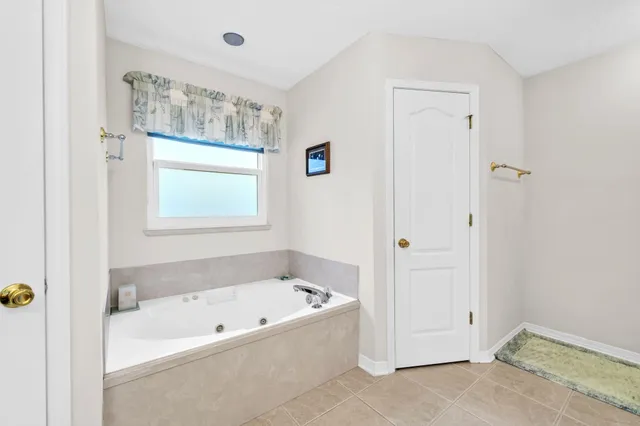 a bathroom that has a glass shower door