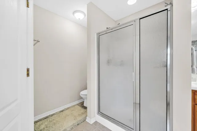 a backyard of a house with garden and outdoor seating