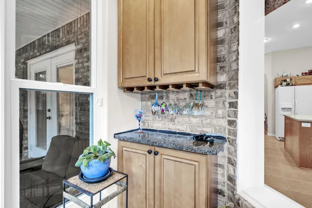 a balcony with furniture and wooden floor