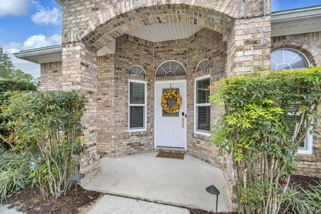 a view of a living room and a wooden floor