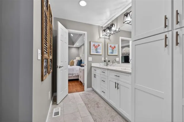 a bedroom with a bed and a dresser