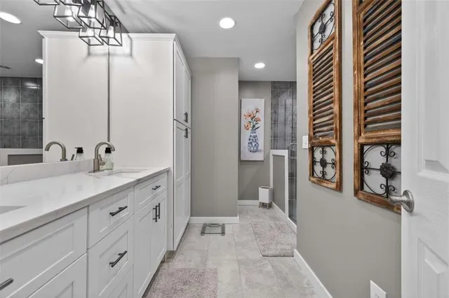 a bathroom with a sink a toilet and a window