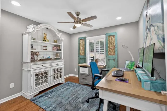 a living room with furniture a flat screen tv and gym equipment