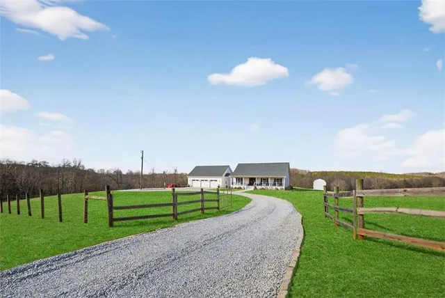 a living room with fireplace furniture and a wooden floor