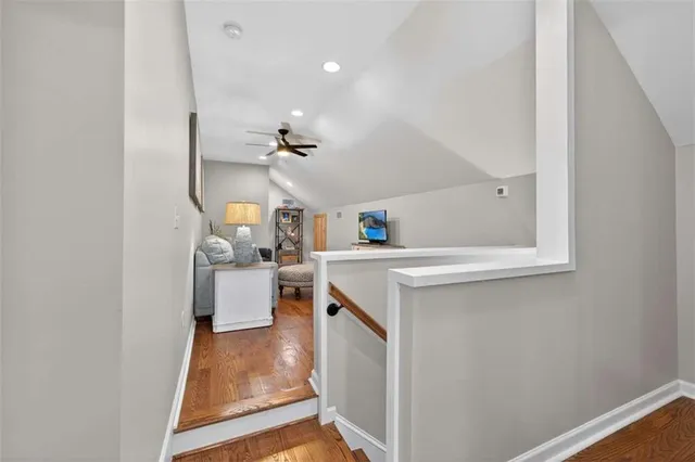 a view of a house with backyard and lake view