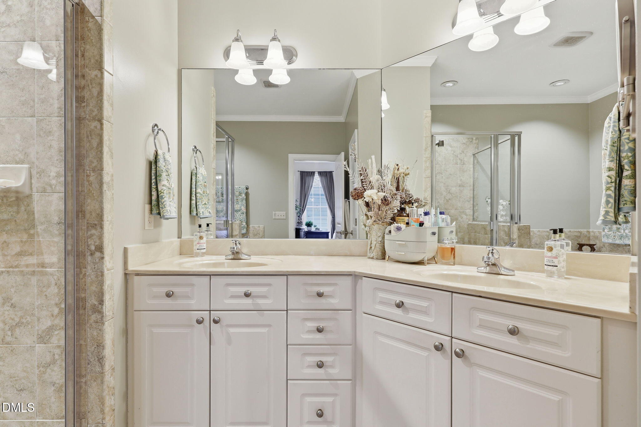 7040 Dayton Ridge Drive Apex, NC 27539 - Photo 22 of 38 a bathroom with a double vanity sink and a mirror