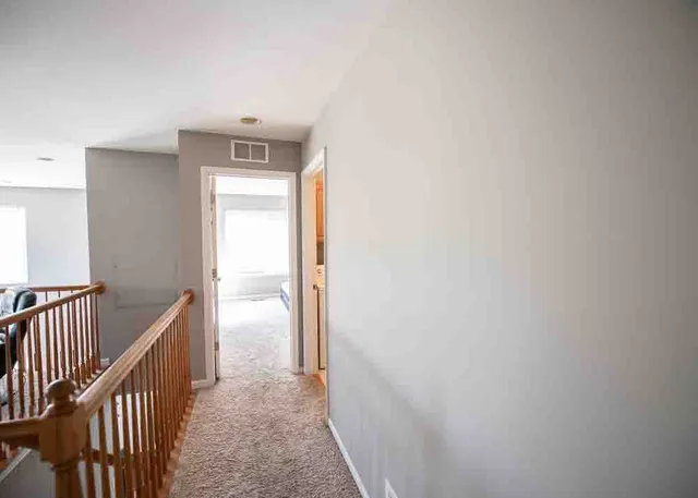 a balcony with furniture and a window