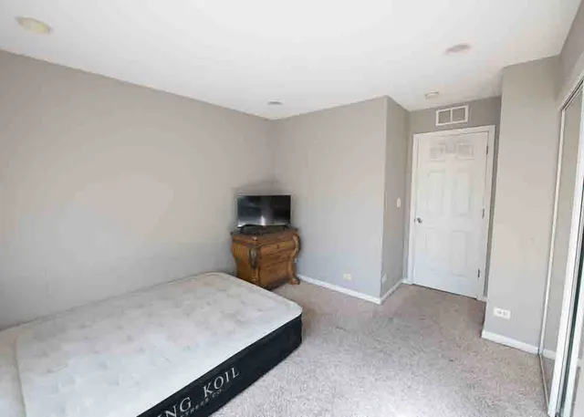 a room with a bed and a window