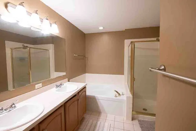 a bathroom with a bathtub and a shower