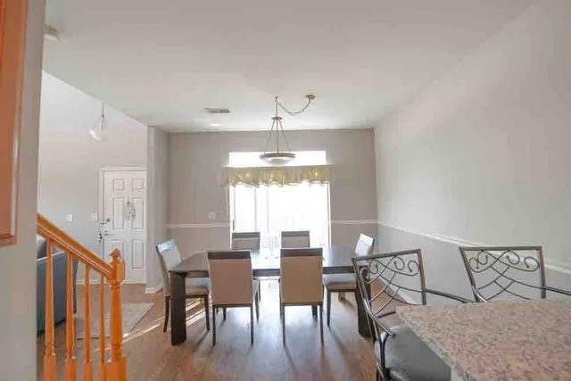 a kitchen with stainless steel appliances granite countertop sink stove and cabinets