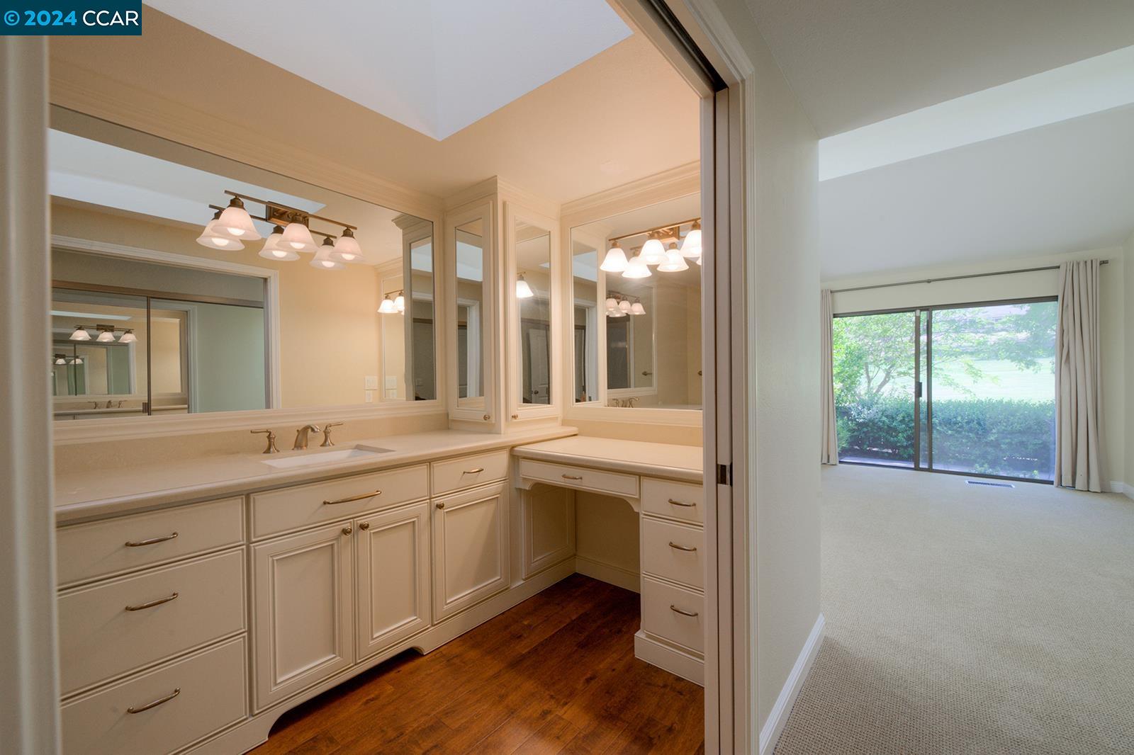 564 Cambrian Way Danville, CA 94526 - Photo 5 of 13 a spacious bathroom with a granite countertop sink mirror and a