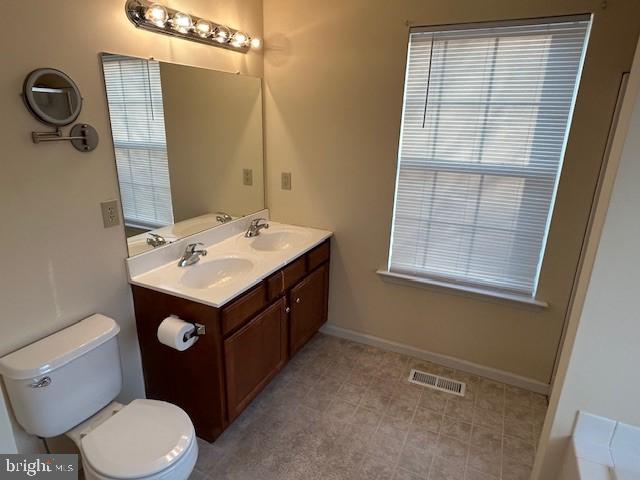 501 Buchanan Road Perkasie, PA 18944 - Photo 40 of 56 a bathroom with a sink vanity mirror and toilet