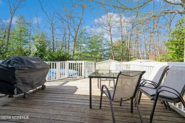 a view of a chairs and table on the wooden floor