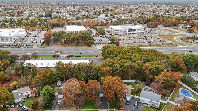 an aerial view of residential houses with outdoor space