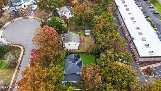 an aerial view of house with yard