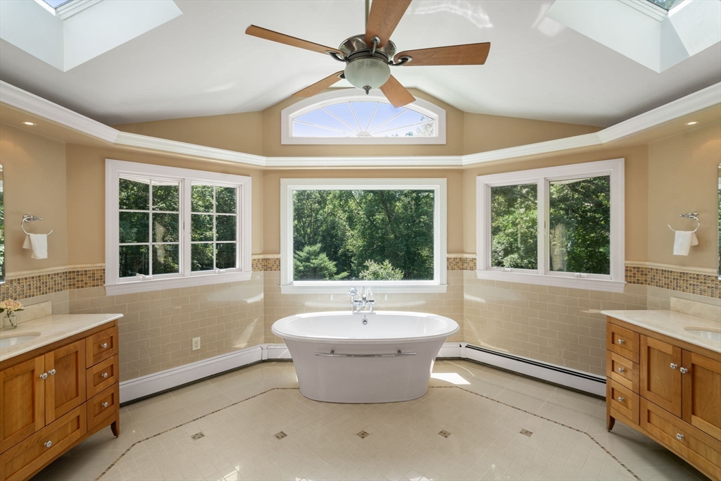 24 Russett Hill Road Sherborn, MA 01770 - Photo 21 of 39 a spacious bathroom with a large tub and sink