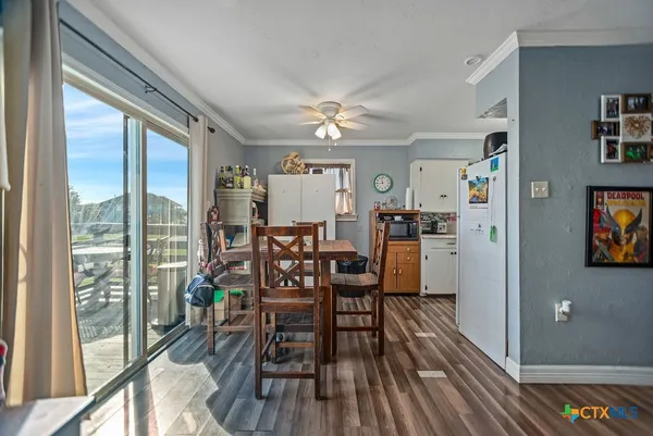 a kitchen with a stove a sink and a microwave