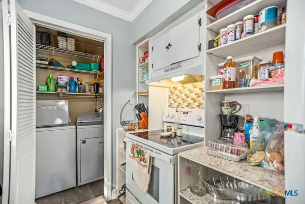 a bathroom with a granite countertop sink a toilet and shower