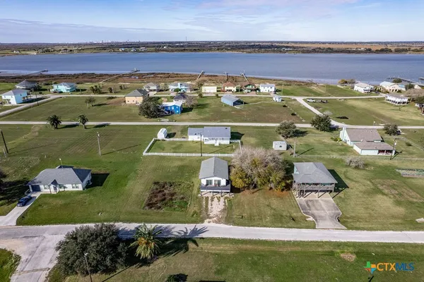an aerial view of a pool patio swimming pool and outdoor seating