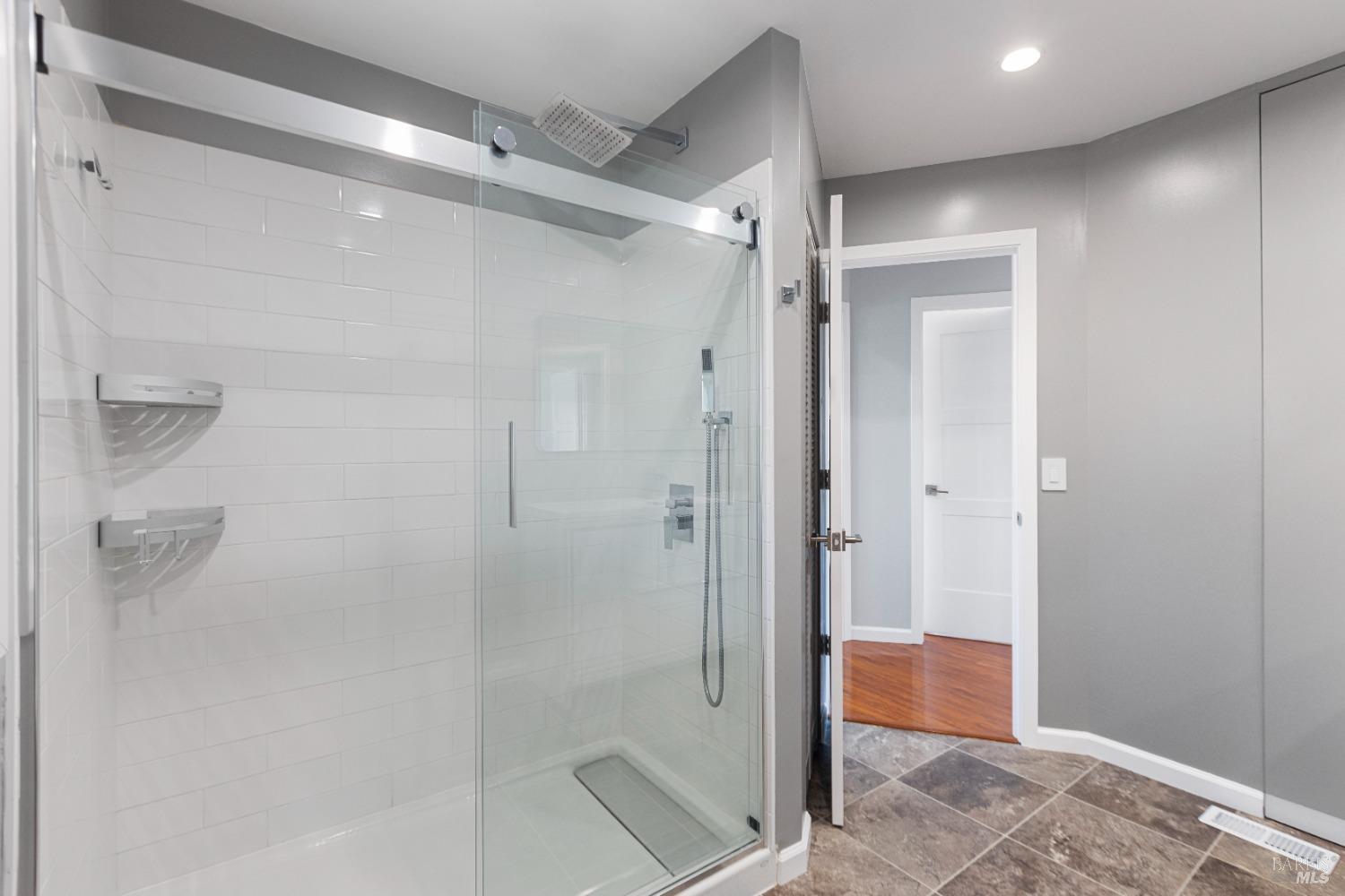 363 Glacier Way San Rafael, CA 94903 - Photo 12 of 20 a bathroom with a shower and a glass door